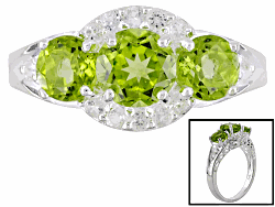 sterling silver 2.05ctw round Manchurian peridot and .30ctw round white topaz ring. this ring measures 5/8 inch from knuckle to knuckle. this ring is not sizeable.